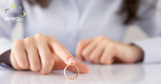 woman holding a wedding ring